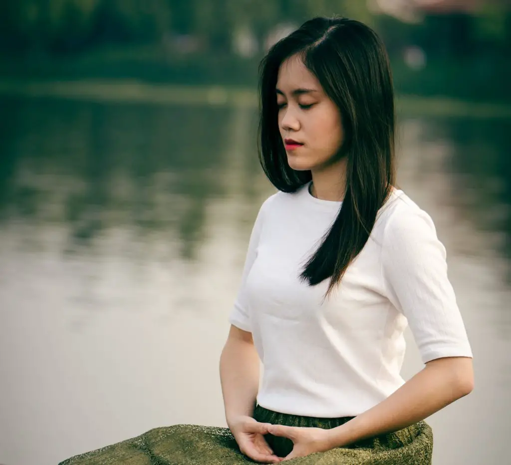 meditator benefitting from taking a deep breath
