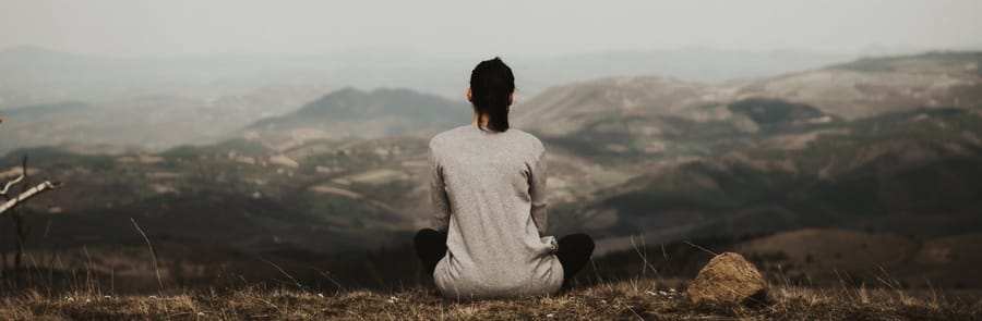 woman who is new to meditation and is learning to meditate outside